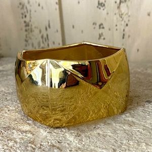 Gold coloured hinged bangle bracelet